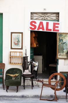 Old vintage objects put up for sale on the pavement in Malta