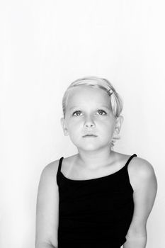 Isolated portrait of a beautiful girl, shot black and white. Space for text. 