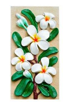 Stucco images of colorful flowers frangipani.