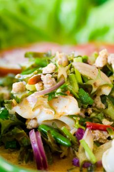 Winged bean in spicy coconut sauce salad, Thai food.