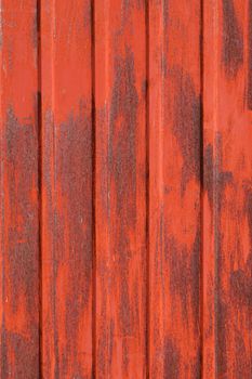 old red metal door in ruins