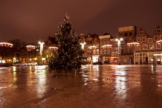 City scenic from Amsterdam at the Nieuwmarkt in the Netherlands by night