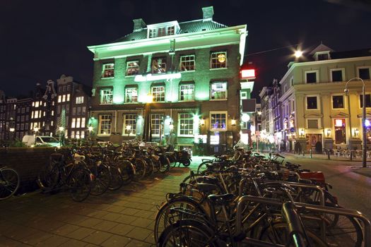 Illuminated medieval buildings in Amsterdam the Netherlands at night