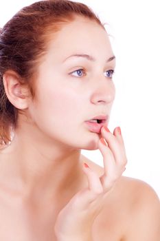 Wellness, healthcare, skin care. Lovely woman touching her lips on white backgroun.
