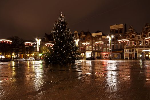 City scenic from Amsterdam at the Nieuwmarkt in the Netherlands by night