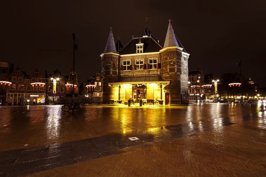 City scenic from Amsterdam at the Nieuwmarkt in the Netherlands by night