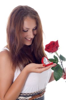 girl was presented with a red rose and a box with a ring
