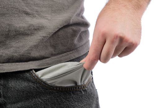 Closeup of a man holding out his empty pocket, isolated on a white background.