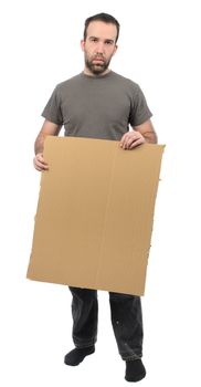 A scruffy looking guy holding a blank piece of cardboard, isolated on a white background.