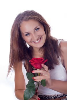 portrait of attractive caucasian smiling woman isolated on white studio shot with red rose looking at camera