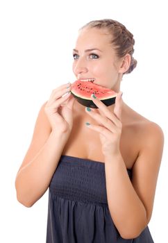 Woman against white background taking a bite of watermelon
