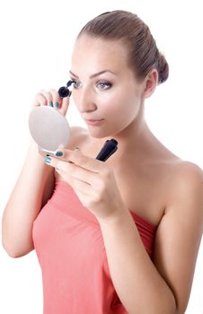 portrait beautiful young woman bare shoulders looks mirror paints eyelashes background 
