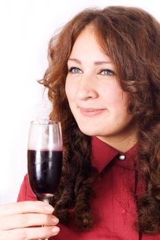 Closeup of beautiful female lips drinking wine from a glass with dewdrops on it.