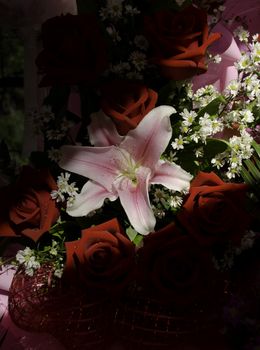 Bouquet of pink lily with red roses