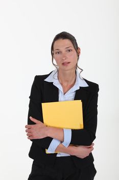 young woman in suit holding a folder