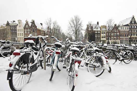 Snowy bikes in Amsterdam the Netherlands
