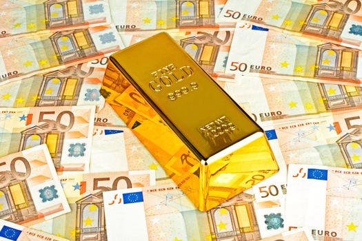 Gold bar and euro money