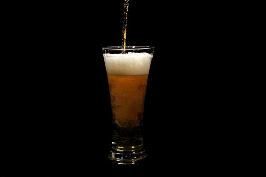 Beer pouring into a glass