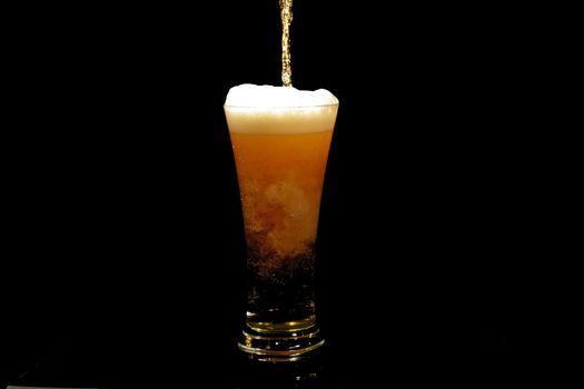 Beer pouring into a glass