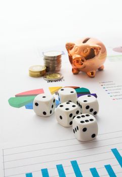 Saving money. Gambling concept.Pig, coins and dices composition