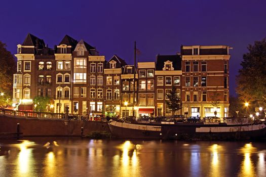 Medieval houses at the Amstel in Amsterdam the Netherlands at night