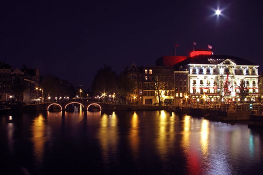 City scenic from Amsterdam by night in the Netherlands