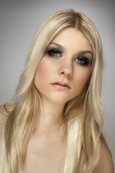 attrative blonde girl portrait, dark makeup