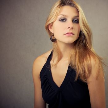 attractive beautiful blond girl in black clothes
