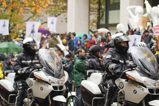 PORTLAND, OREGON - NOV 17: Motorcycle Police Watching over protestors in Downtown Portland, Oregon during a Occupy Portland protest on the first anniversary of Occupy Wall Street November 17, 2011