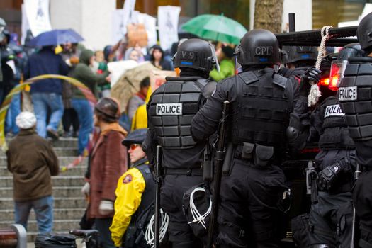 PORTLAND, OREGON - NOV 17: Police in Riot Gear on Vehicle in Downtown Portland, Oregon during a Occupy Portland protest on the first anniversary of Occupy Wall Street November 17, 2011