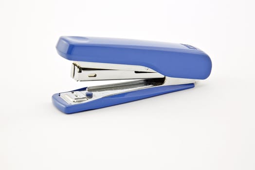Closeup of a blue stapler on a white background