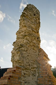 Closeup of a wall ruin reinforced with bricks