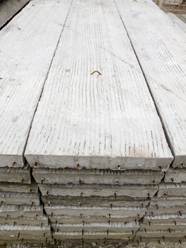 Stack of concrete building slab on ground in stock