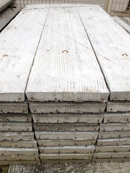 Stack of concrete building slab on ground in stock