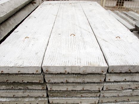 Stack of concrete building slab on ground in stock