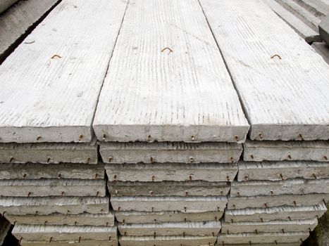 Stack of concrete building slab on ground in stock