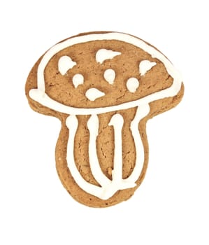 A piece of mushroom-shaped gingerbread isolated on white