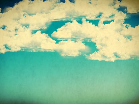 Vintage background in the blue shade with clouds