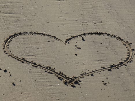 A heart shape drawn in the sand