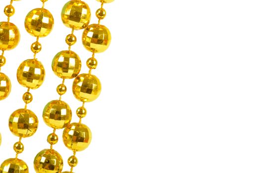 Background made of a brilliant celebratory beads of golden color