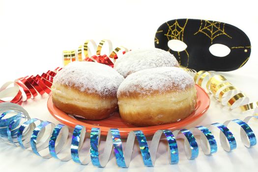 a plate of donuts and carnival decoration