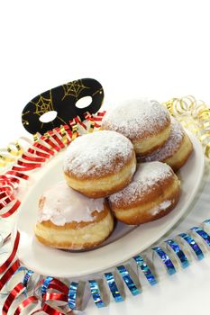 a plate of donuts and carnival decoration