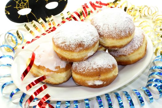 a plate of donuts and carnival decoration