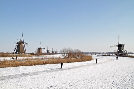 Ice skating at Kinderdijk in the winter in the Netherlands