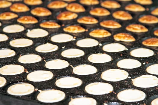 freshly baked traditional Dutch mini pancakes called "poffertjes