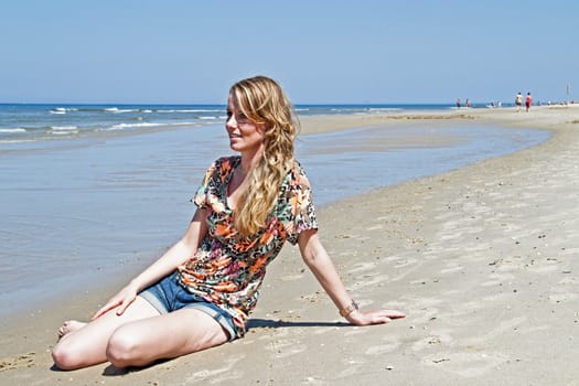 Beautiful young woman at the beach