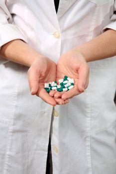 pharmacist holding pills indoor