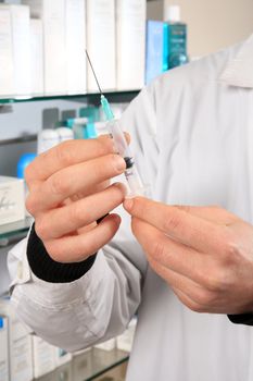 pharmacist holding injection indoor