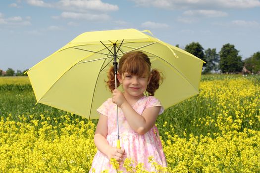 little girl with yellow umbrella