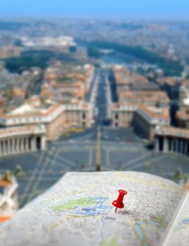 Push pin pointing St. Peter's square on Vatican city map
